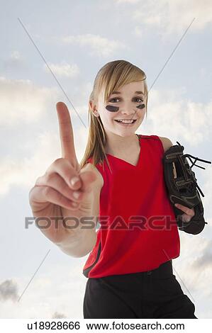 Portrait of girl (12-13) plying softball View Large Photo Image Stock Photograph - Portrait of girl (12-13) plying softball. Fotosearch