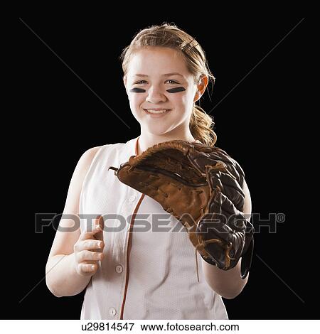 Portrait of girl (12-13) plying softball, studio shot View Large Photo Image Stock Photo - Portrait of girl (12-13) plying softball, studio shot. Fotosearch