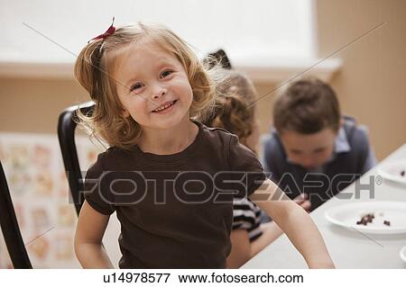 Stock Photo - Portrait of girl (2-3) in kindergarten. Fotosearch