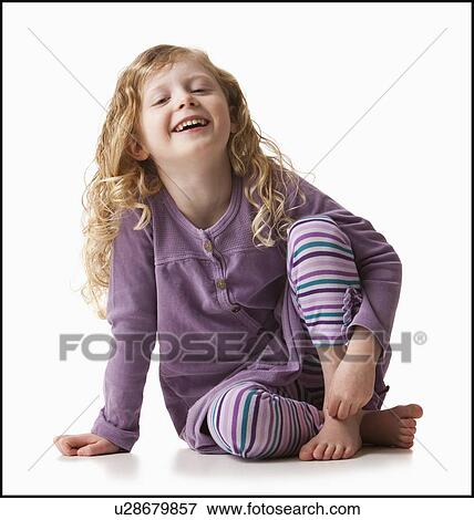 Stock Photo - Portrait of girl (4-5), studio shot. Fotosearch