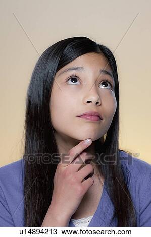 Portrait of girl lost in thoughts View Large Photo Image Stock Image - Portrait of girl lost in thoughts . Fotosearch