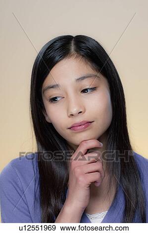 Stock Photo - Portrait of girl with sad face. Fotosearch