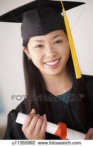 Portrait of graduated young woman View Large Photo Image Stock Image - Portrait of graduated young woman. Fotosearch