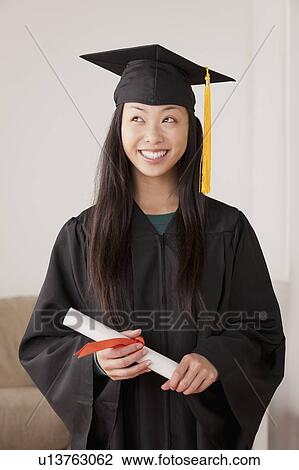 Portrait of graduated young woman View Large Photo Image Stock Image - Portrait of graduated young woman. Fotosearch