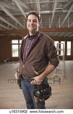 Stock Image - Portrait of handyman. Fotosearch