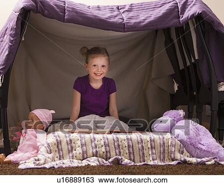 Portrait of happy girl (4-5) in playhouse View Large Photo Image Stock Image - Portrait of happy girl (4-5) in playhouse. Fotosearch