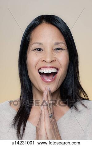 Stock Image - Portrait of laughing woman. Fotosearch