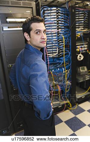 Portrait of male IT support technician View Large Photo Image Stock Image - Portrait of male IT support technician. Fotosearch