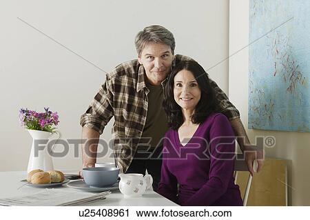 Stock Image - Portrait of mature couple at home. Fotosearch