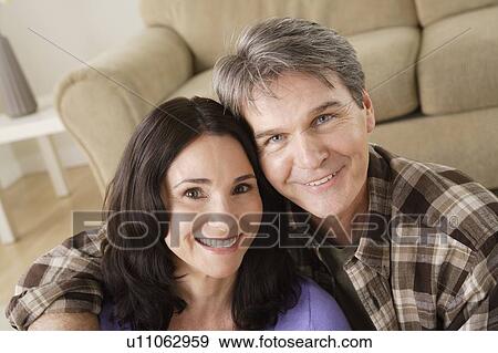 Stock Photo - Portrait of mature couple at home. Fotosearch
