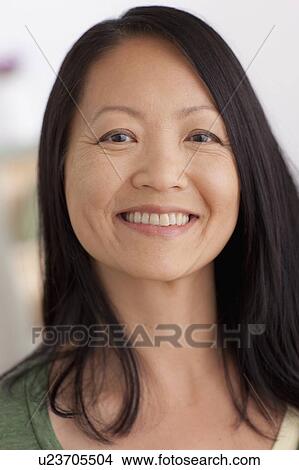 Portrait of mature woman smiling View Large Photo Image Picture - Portrait of mature woman smiling. Fotosearch