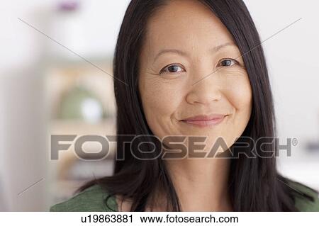 Portrait of mature woman smiling View Large Photo Image Stock Image - Portrait of mature woman smiling. Fotosearch