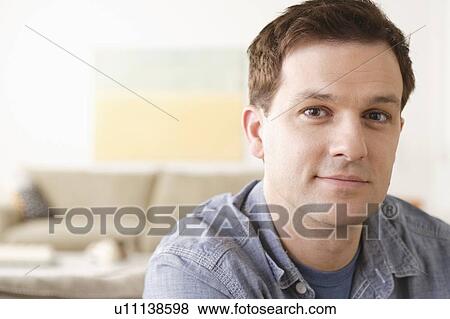 Stock Photo - Portrait of mid adult man. Fotosearch