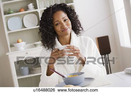 Portrait of mid adult woman at breakfast View Large Photo Image Stock Photograph - Portrait of mid adult woman at breakfast. Fotosearch