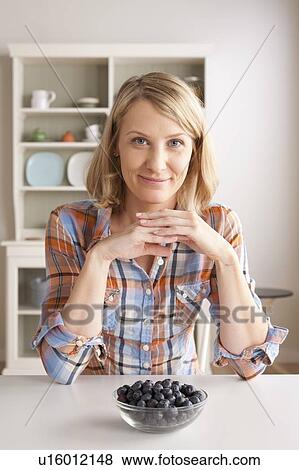Portrait of mid adult woman with bowl of grapes View Large Photo Image Stock Photo - Portrait of mid adult woman with bowl of grapes. Fotosearch