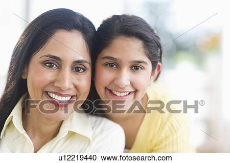 Portrait of mother and daughter (12-13) at home View Large Photo Image Stock Image - Portrait of mother and daughter (12-13) at home. Fotosearch