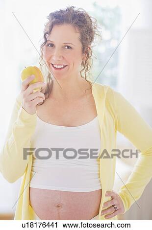 Portrait of pregnant woman eating breakfast View Large Photo Image Stock Image - Portrait of pregnant woman eating breakfast. Fotosearch