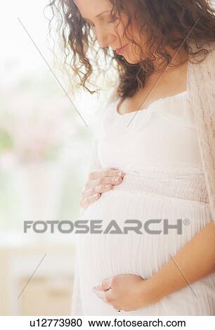 Stock Image - Portrait of pregnant woman. Fotosearch