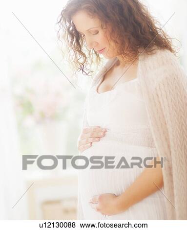 Stock Photo - Portrait of pregnant woman. Fotosearch
