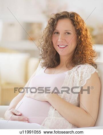 Stock Photography - Portrait of pregnant woman. Fotosearch