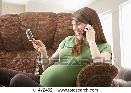 Portrait of pregnant woman watching ultrasonography scan View Large Photo Image Stock Image - Portrait of pregnant woman watching ultrasonography scan. Fotosearch