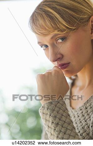 Stock Image - Portrait of sad woman. Fotosearch