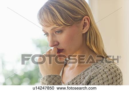 Stock Image - Portrait of sad woman. Fotosearch
