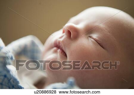 Stock Photo - Portrait of sleeping baby boy (2-5 months). Fotosearch