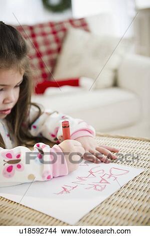 Portrait of small girl (4-5 years) writing letter to Santa Claus View Large Photo Image Picture - Portrait of small girl (4-5 years) writing letter to Santa Claus. Fotosearch
