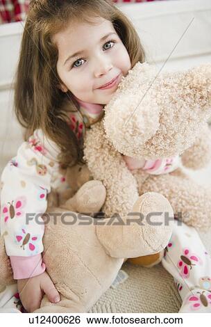 Portrait of small girl (4-5 years) with puppets View Large Photo Image Stock Photograph - Portrait of small girl (4-5 years) with puppets. Fotosearch