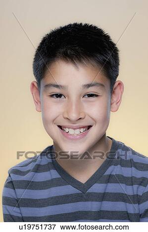 Portrait of smiling boy in striped t-shirt View Large Photo Image Stock Photo - Portrait of smiling boy in striped t-shirt. Fotosearch
