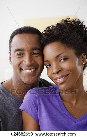 Stock Image - Portrait of smiling couple. Fotosearch