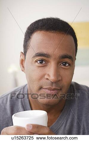 Portrait of smiling mature man holding mug View Large Photo Image Stock Photography - Portrait of smiling mature man holding mug. Fotosearch