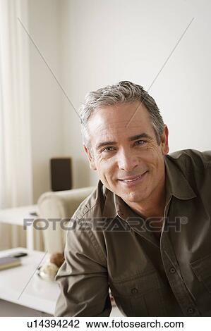 Stock Image - Portrait of smiling mature man. Fotosearch