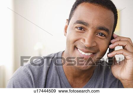 Portrait of smiling mature man talking via mobile View Large Photo Image Stock Photo - Portrait of smiling mature man talking via mobile . Fotosearch