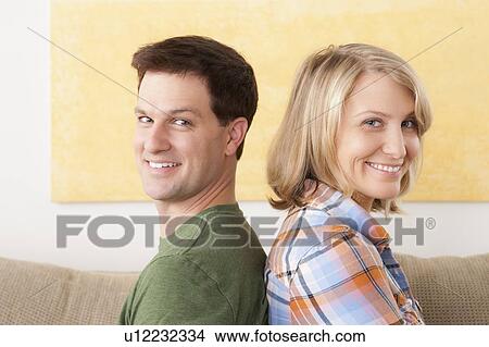 Portrait of smiling mid adult couple View Large Photo Image Picture - Portrait of smiling mid adult couple. Fotosearch