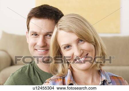 Portrait of smiling mid adult couple View Large Photo Image Picture - Portrait of smiling mid adult couple. Fotosearch