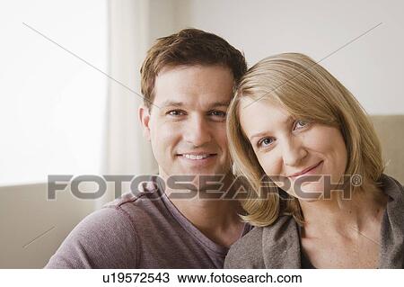Portrait of smiling mid adult couple View Large Photo Image Stock Image - Portrait of smiling mid adult couple. Fotosearch