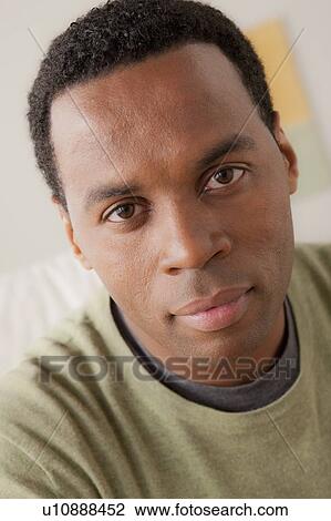 Stock Image - Portrait of smiling mid adult man. Fotosearch