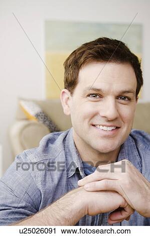Portrait of smiling mid adult man View Large Photo Image Stock Image - Portrait of smiling mid adult man. Fotosearch