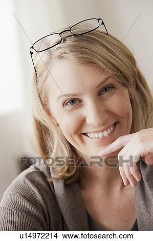 Picture - Portrait of smiling mid adult woman. Fotosearch
