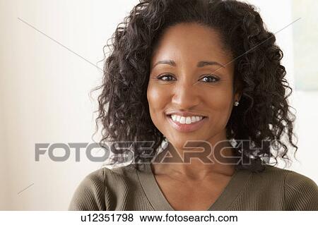 Portrait of smiling mid adult woman View Large Photo Image Stock Photo - Portrait of smiling mid adult woman . Fotosearch