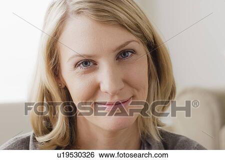Portrait of smiling mid adult woman View Large Photo Image Stock Photograph - Portrait of smiling mid adult woman. Fotosearch