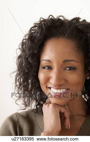 Stock Photography - Portrait of smiling mid adult woman . Fotosearch