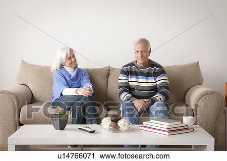 Stock Image - Portrait of smiling senior couple. Fotosearch