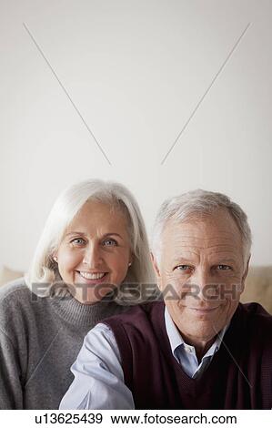 Stock Photo - Portrait of smiling senior couple. Fotosearch
