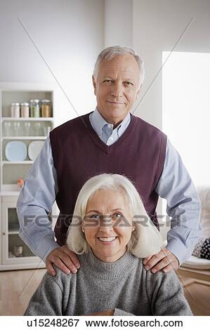 Stock Photo - Portrait of smiling senior couple. Fotosearch