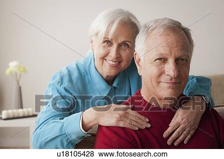 Stock Photo - Portrait of smiling senior couple. Fotosearch