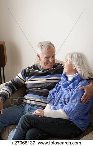 Stock Photo - Portrait of smiling senior couple. Fotosearch