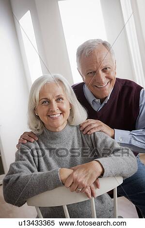 Stock Photography - Portrait of smiling senior couple. Fotosearch